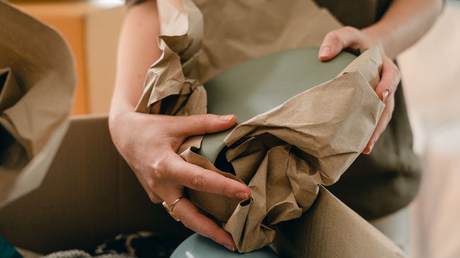 Wrapping household items in packing paper