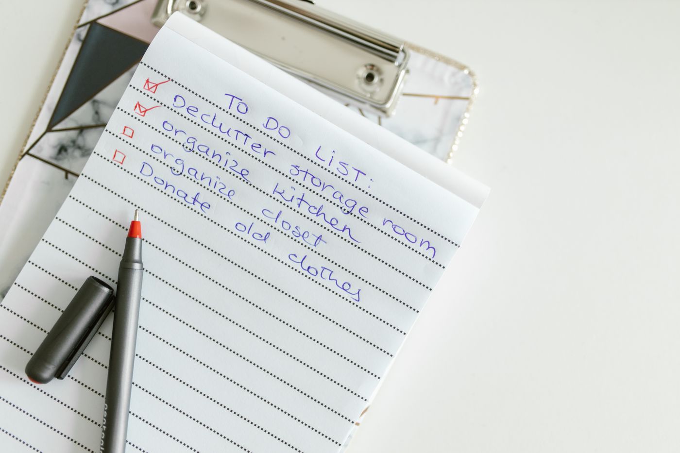 Handwritten to-do list in a notepad