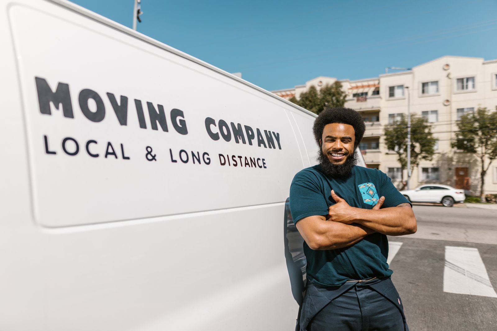 Delta Movers Pro mover beside the company van